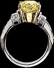 Oval fancy yellow diamond and  round diamond ring
